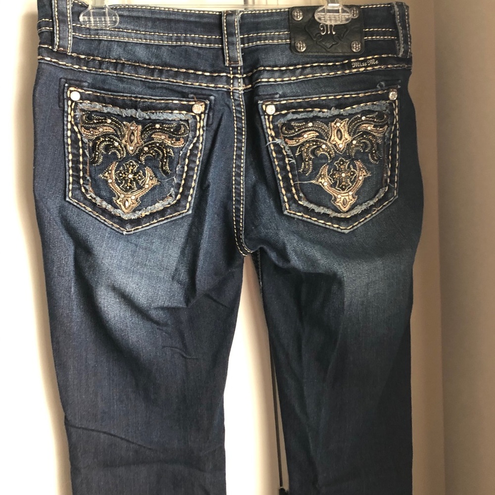 Buckle Miss Me jeans.